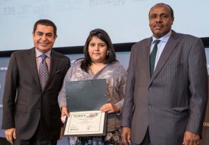 Canada's Haylee Nottaway, winner of the PLURAL+ 2015 International Jury Award in the 13-17 year category, with Nassir Abdulaziz Al-Nasser, High Representative of the UNAOC (left) and Ashraf El Nour, IOM Permanent Observer to the UN.