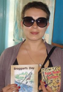 Bulgarian filmmaker Maya Vitkova with copies of From Terror to Hope and The Braggart's Day