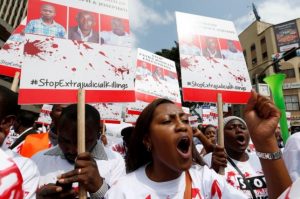A member of the civil society chants slogans during a protest dubbed "Stop extrajudicial killings" on the killing of human rights lawyer, Willie Kimani, his client and their driver in Nairobi, Kenya, July 4, 2016. REUTERS/Thomas Mukoya